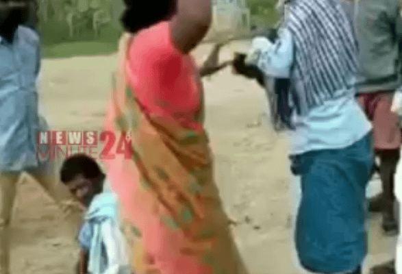 దళితుడి పై టిఆర్ఎస్ మహిళ సర్పంచ్ చెప్పుతో దాడి..!!